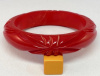 BB451 chunky lightly marbled red slash carved bakelite bangle